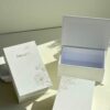 Luxury magnetic flip book style packaging box in white rigid paper, suitable for jewelry and gift packaging