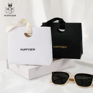 Custom paper gift bag with ribbon handle and logo branding