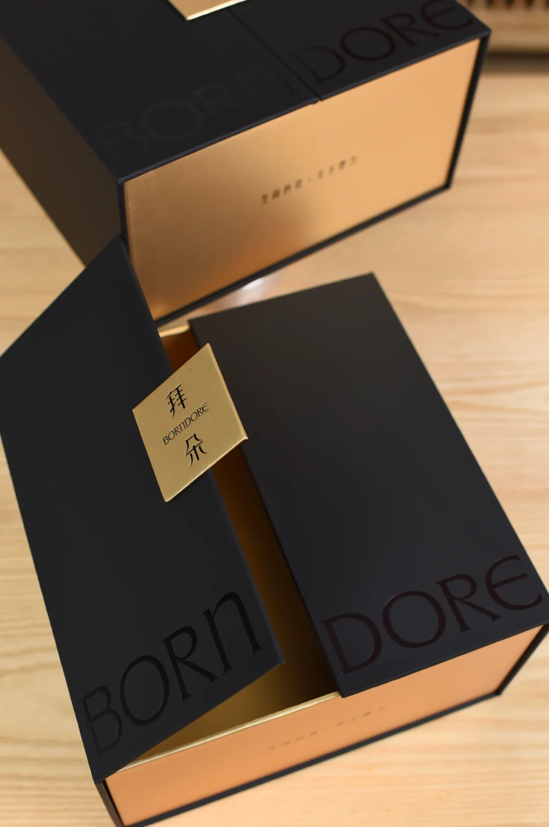 Luxury double door magnetic gift box in black and gold with premium rigid structure and metal logo plate