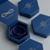 Luxury blue hexagon jewelry box with gold foil logo and velvet insert for bracelet and necklace packaging